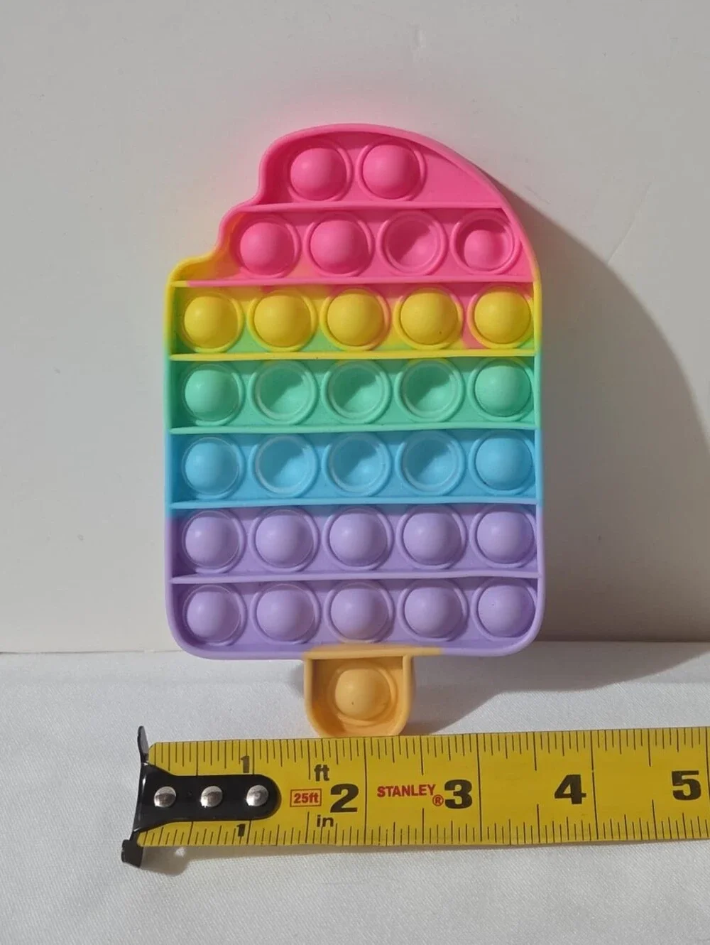 popcicle shaped rainbow pop-it fidget toy